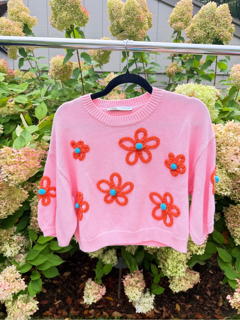 Zara Pink Sweater with Orange Floral Appliqués and Blue Centers